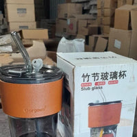 Over glass water bottle with straw